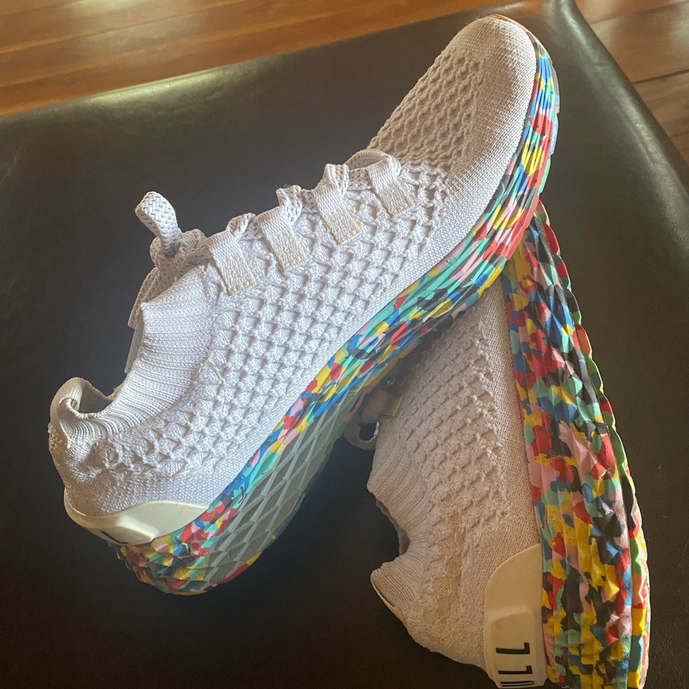 NOBULL runners in white wild with multi color bottoms.